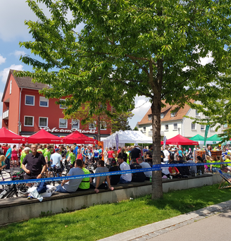 Red 3x3m gazebo, green 3x3m gazebo and white 6x3m gazebo at a folk festival in Germany